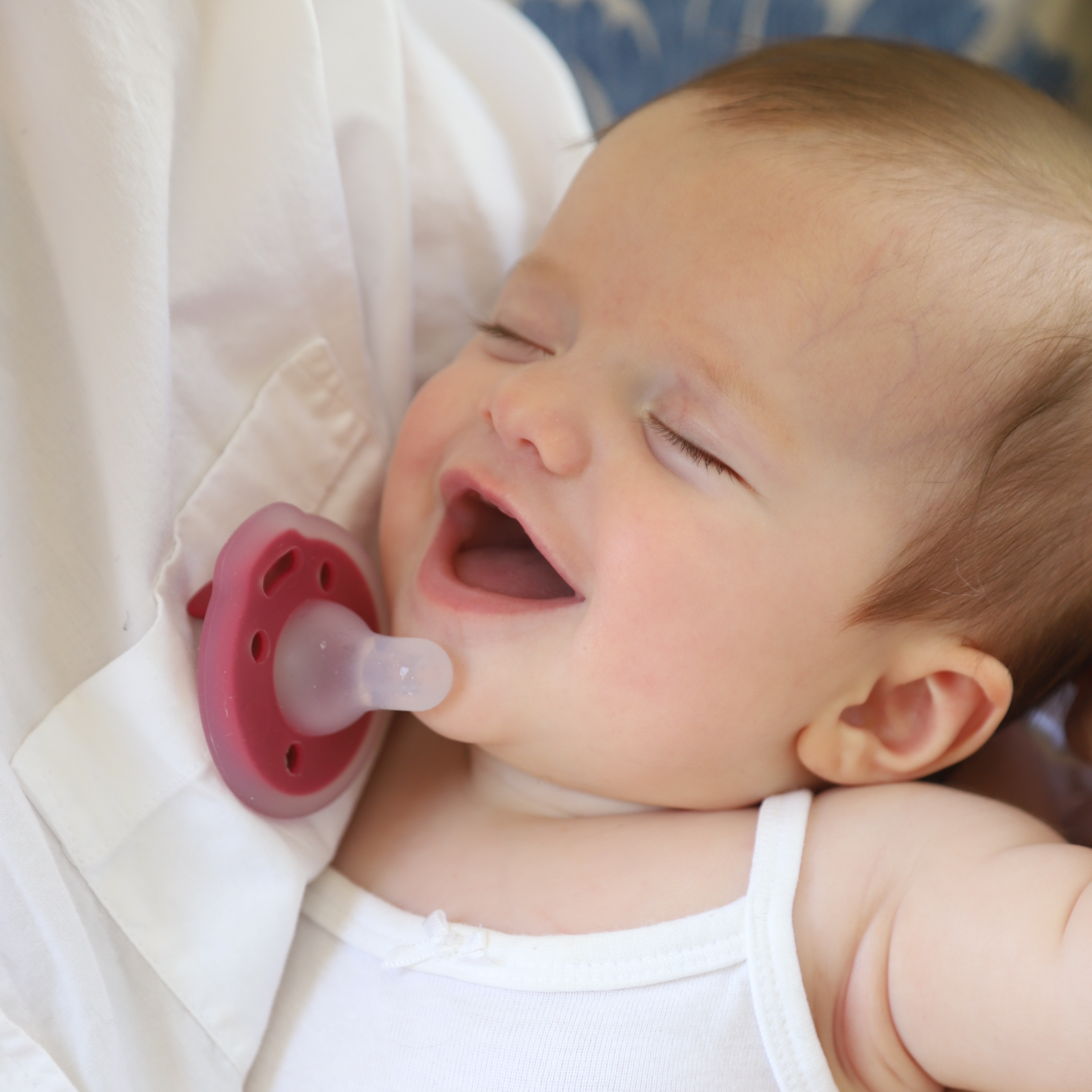 mōmi babypace® breast-like pacifier in rich cranberry red